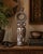 A striking hand-carved African tribal mask sculpture crafted from a single block of wood and finished with traditional...