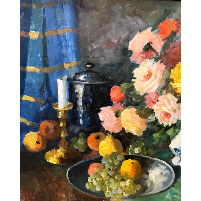 This oil painting portrays a vibrant still life on a table with a bouquet of multicolored roses in pinks, yellows, oranges...