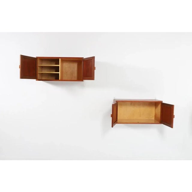 Beautiful varnished teak wall cabinets designed and produced in Denmark by Johannes Andersen. Condition Good, some marks....