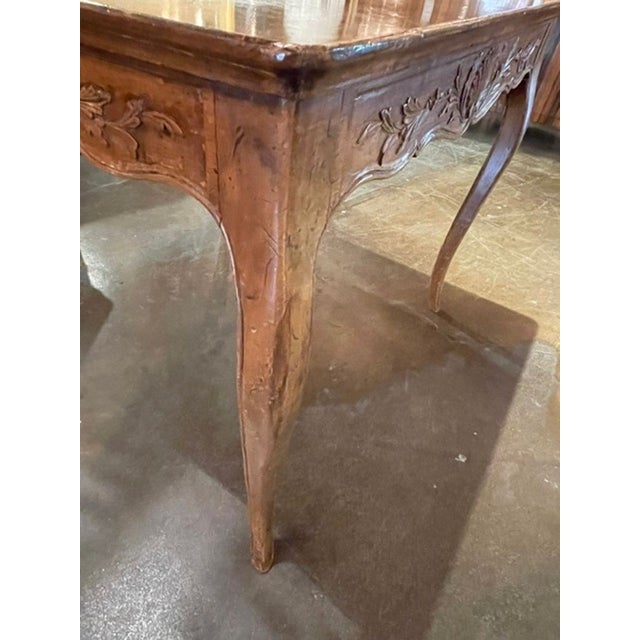 This Vintage French Provincial Carved Walnut Games Table is a stunning piece of furniture that combines elegance and...