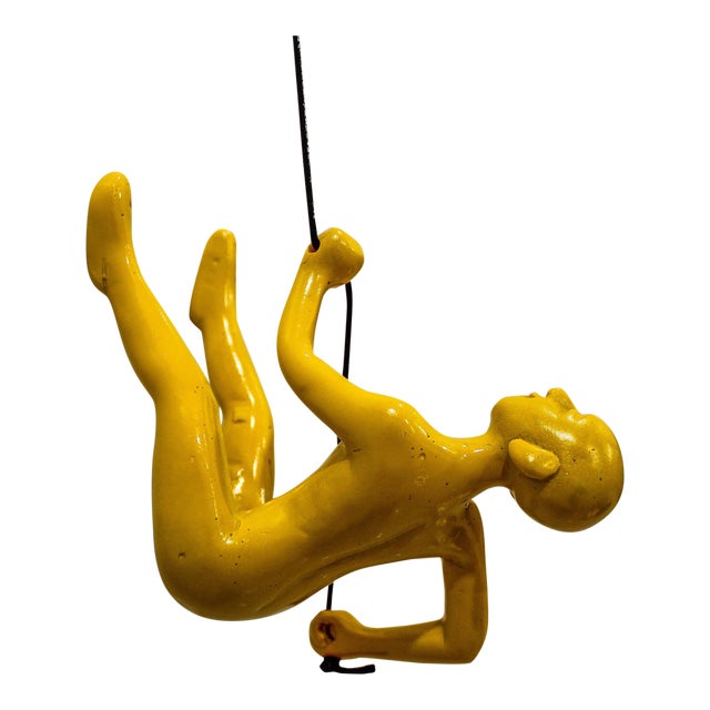 Yellow Climbing Man Wall Art For Sale