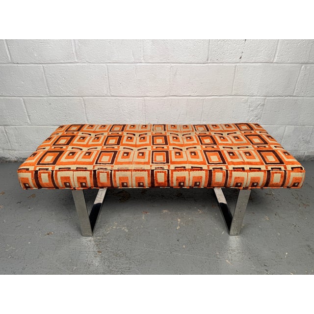 Chic mid-century modern bench with a streamlined frame and upholstered seat, balancing comfort with elegant simplicity....