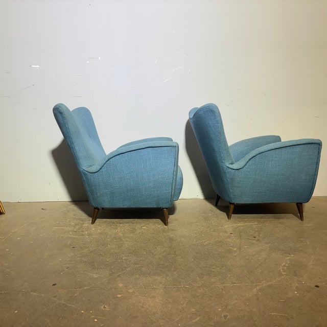 Pair of mid-century blue fabric armchairs, 1950s design by Isa Bergamo. Dimensions: 70 x 36 cm, seat height 36 cm, total...