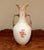 A stunning example of German artistry, this large antique porcelain vase features a sophisticated tall-shouldered...