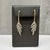 These elegant diamond dangle earrings are crafted in 14kt yellow gold with white rhodium plating on the prongs to enhance...