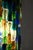 Colorful vintage pendant. The base is made of brass and the light shines beautiful through the colorful glass beads. In a...