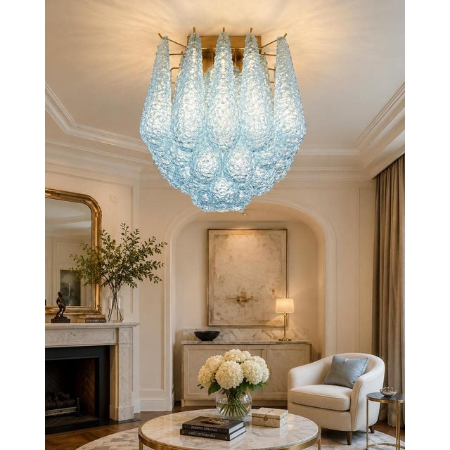 Pair ceiling lamps with 32 blue light blue Murano Glasses in golden painted metal frame. Elegant lighting object. Period:...
