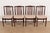 A sleek and stylish set of four mid-century Danish Modern sculpted rosewood dining chairs By Vamdrup Stolefabrik Denmark,...