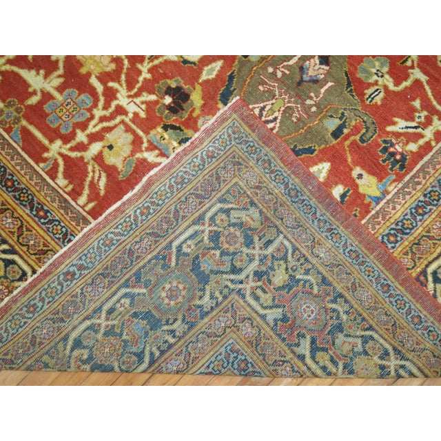 A breathtaking antique late 19th century Persian ZIegler Sultanabad rug with fascinating colors and an interesting all-...