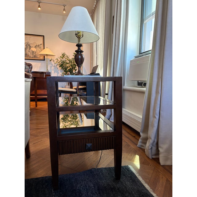 Noir Furniture Lesly side table in a brown finish. Solid birch with a mirrored top and two mirrored lower shelves, plus...