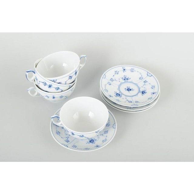 Royal Copenhagen Blue Fluted Plain, tea cups with saucers, late 20th century. Set of four tea cups with matching saucers,...