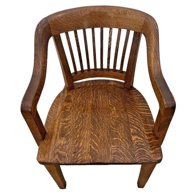 Stunning antique American stationary armchair, expertly crafted from solid quarter-sawn white oak on a classic four-leg...