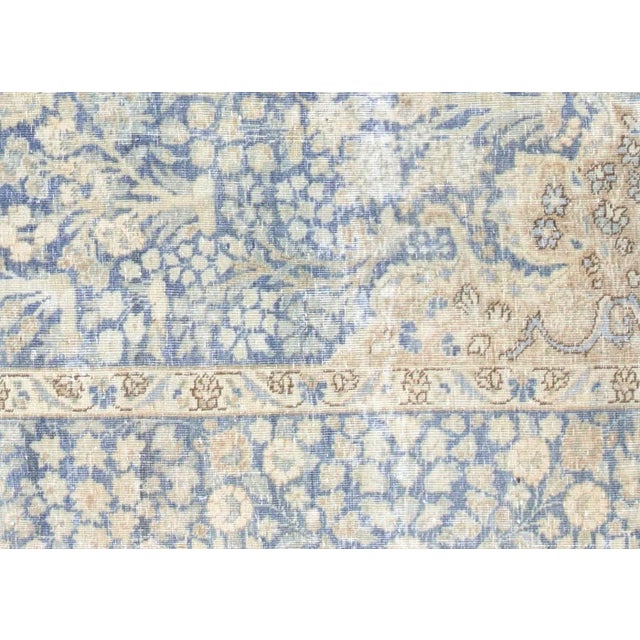 This lavish hand-knotted Persian Tabriz rug adds the perfect touch of elegance to any space. Its intricate design features...