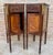 Elegant pair of French bedside nightstands in the Empire style, crafted in wood and decorated with contrasting geometric...