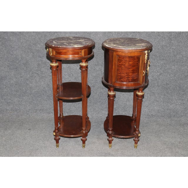 Dimensions: 31.5 inches high x 17.5 inches wide x 14.5 inches deep A beautifully crafted and highly decorative pair of...