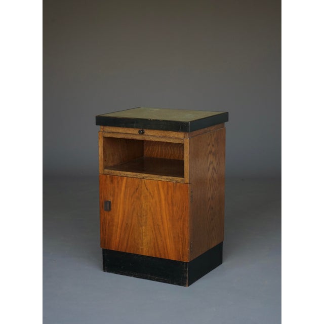 A single nightstand , produced by the Dutch firm Pander& zn. The design possibly by Hendrik Wouda. Very fine example of so...