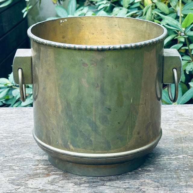 Vintage faux bamboo Jardiniere planter with ring hardware fashioned from solid brass in Hong Kong. Interior diameter 9.25”...
