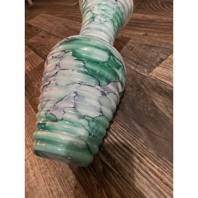 I bought this at a fair trade local market about 10-12 years ago. This vase is absolutely stunning and so well made. The...
