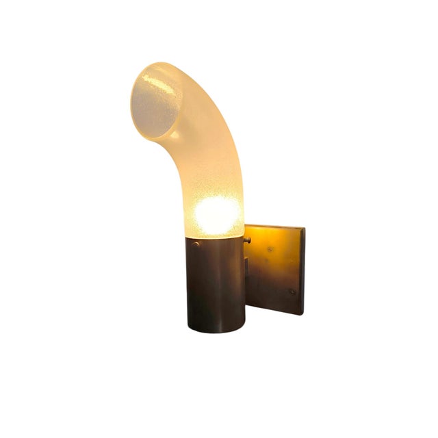 Wall light by Aldo Nason for Mazzega, 1960s, in brass and pulegoso glass. Elegant and sophisticated, it combines fine...