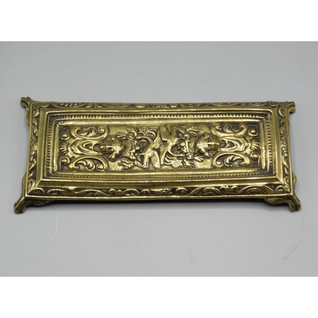 Early 20th-Century English footed pen tray. This lovely desk accessory is well cast bright gilt brass with nice detail. It...