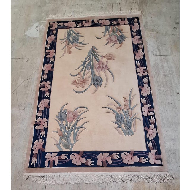 Chinese Art Deco inspired rug featuring a refined botanical composition. and a beautifully balanced color palette. The...