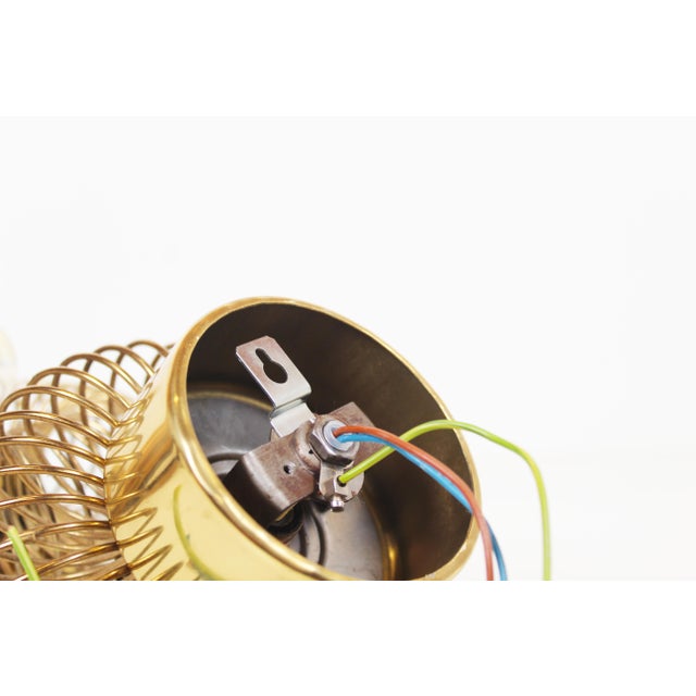 Pair of rare brass wall lamps by Oxar. These lamps are usually offered in chrome, but are less common in brass. Both are...