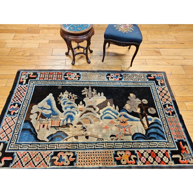 This beautiful antique Ningxia rug from late 19th-century Western China captures a tranquil, painterly landscape scene,...