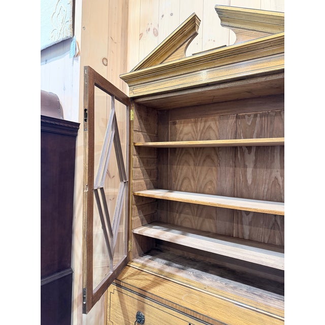 A striking William IV style secretary bookcase, this finely crafted case piece showcases elegant proportions and...