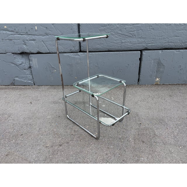 Original Bauhaus Model B 136 Table by Emile Guyot for Thonet from the 1930s, glass and chromed metal. The shelf is not...