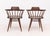 Pair of George Nakashima (American, 1905-1990) American Walnut Captain's Armchairs, 1962, with spindle backs on turned...