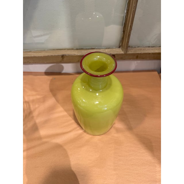 This is a vintage Studio Paran vase. It was made by Richard Jones. It is hand blown glass art. The origin of the company...