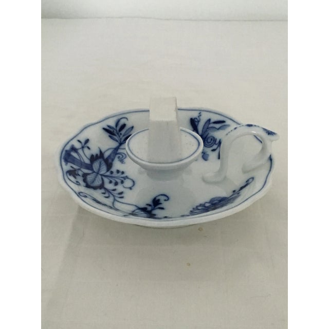 This is a very rare example of a Meissen match striker in the famous Blue Onion pattern. The circular base with undulating...