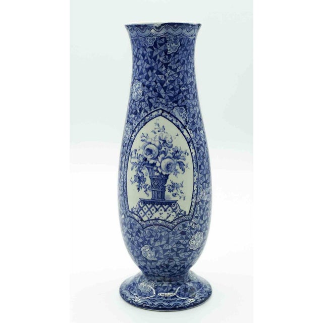 Porcelain vase realized by Franz Anton Mehlem in the late 19th Century in Bonn, Germany. The base shows the crowned shield...