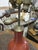 Chinese porcelain bottle vase in a glossy oxblood red glaze, mounted as a table lamp on a carved and pierced giltwood...