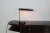- Italian table lamp from circa 1950 - Brass and black lacquered aluminum shade which can be turned sideways - The lamp...
