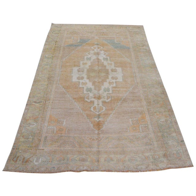 Hand-knotted with care using traditional rug-making techniques, this wool rug blends timeless craftsmanship with a modern...