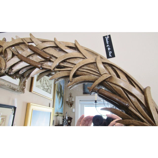 Embrace the elegance of the 1960s with this RARE Large Italian Hand Carved Wood Cattail Mirror, a true testament to the...