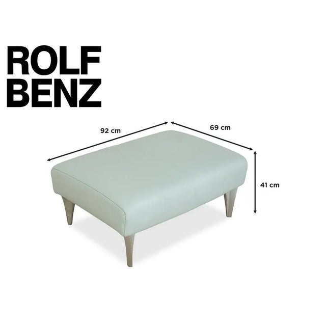 This stool from Rolf Benz's 1600 series is upholstered in light blue genuine leather and stands on simple, elegant metal...