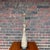 A lovely tall mid-century ceramic table lamp with a unique asymmetrical hourglass shape. The unique glaze has a light...