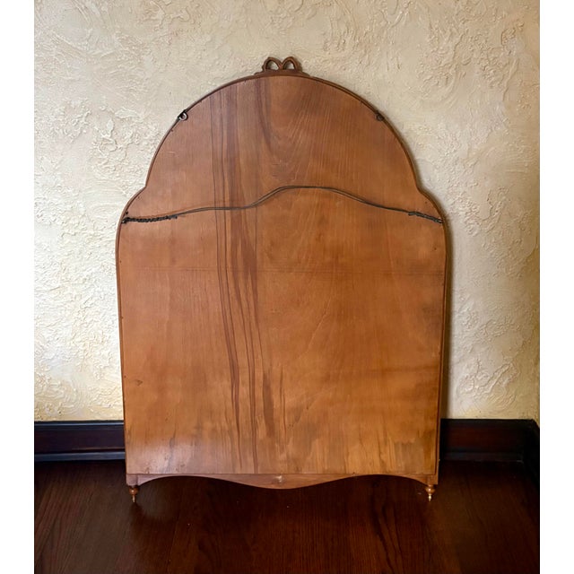The back is solid wood, While the dimensions listed are for the frame, the mirror dimensions are as follows; Length - 35.5...