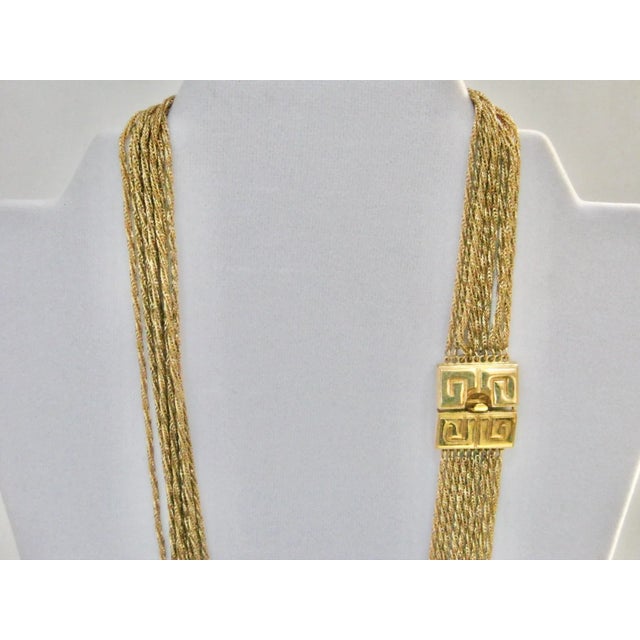 This is part of Chairish’s Costume Jewelry assortment. Gorgeous rare Givenchy multi 9 strand chain signature logo spring...