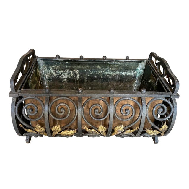 A lovely 19th century French Jardiniere handsomely crafted from iron with its original copper liner.
