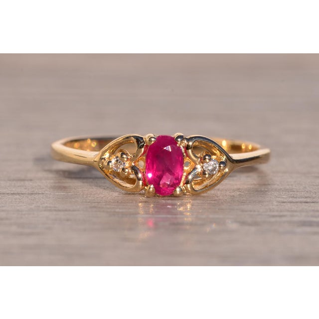 Dos Avenida: Oval Brilliant Cut Ruby and Natural Diamond Heart Ring in Yellow Gold For Sale - Image 9 of 11
