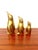A charming trio of brass penguins, dating from the 1960s–1970s, composed of three silhouettes of varying sizes. with their...