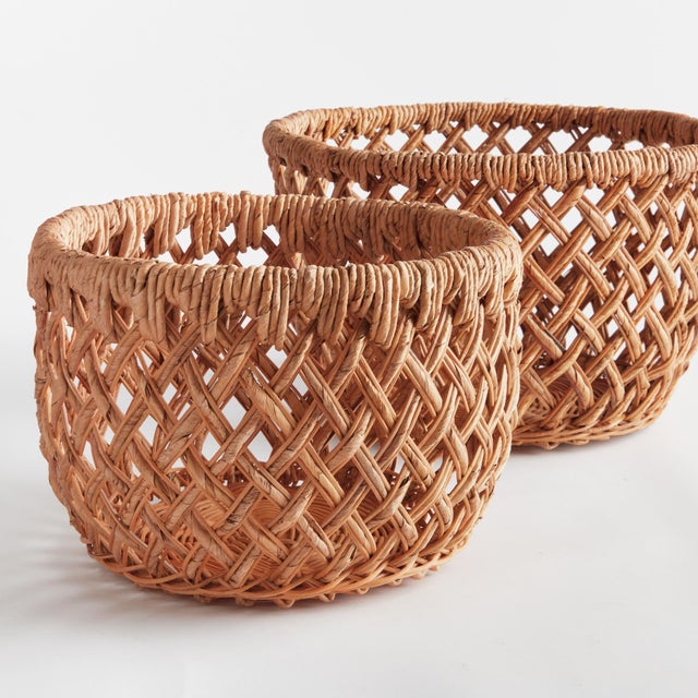 With a unique weave and oval profile, this set of 2 baskets are firm and substantial. Made of durable banana leaves and...