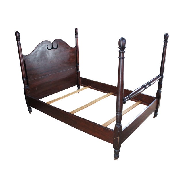 Antique Sheraton style mahogany full-size four-poster bed. Made from mahogany with an open pediment headboard featuring...
