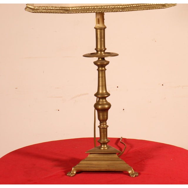 A beautiful lamp formed from a 17th-century Spanish bronze candlestick, converted into a lamp. It has its original...