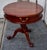 Vintage (1980's) Round Drum Table has a Chippendale Style. Made of Wood. Mahogany. The Table has One Drawer and a Carved...