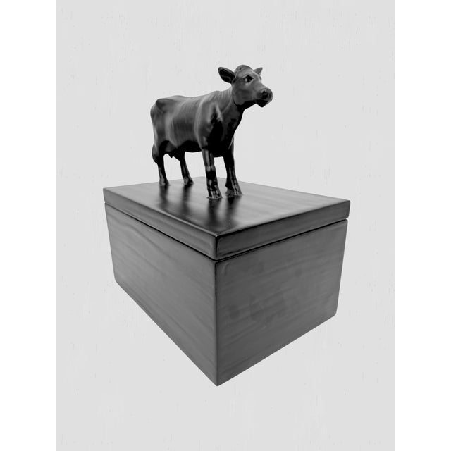 Adorable black cast resin cow fable keepsake box by Oly Studio. Lovely details and a fun piece.