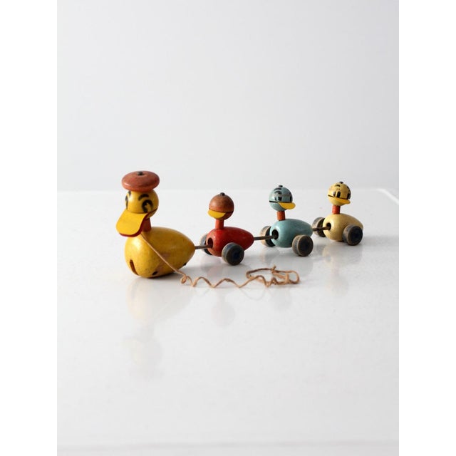 Vintage early 1950s Fisher-Price Quacky Family pull toy, one of the company's most beloved mid-century designs, featuring...